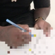 A behind-the-scenes still of Rico Strong signing paperwork.